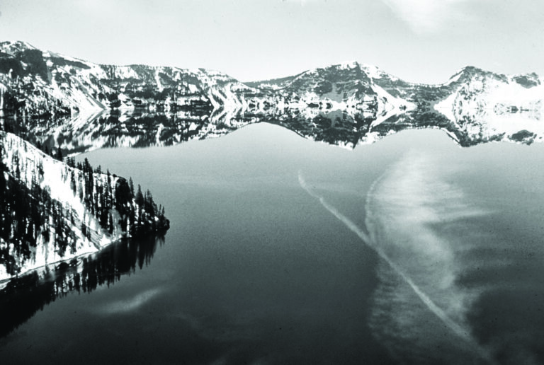 A black and white photo of crater lake.