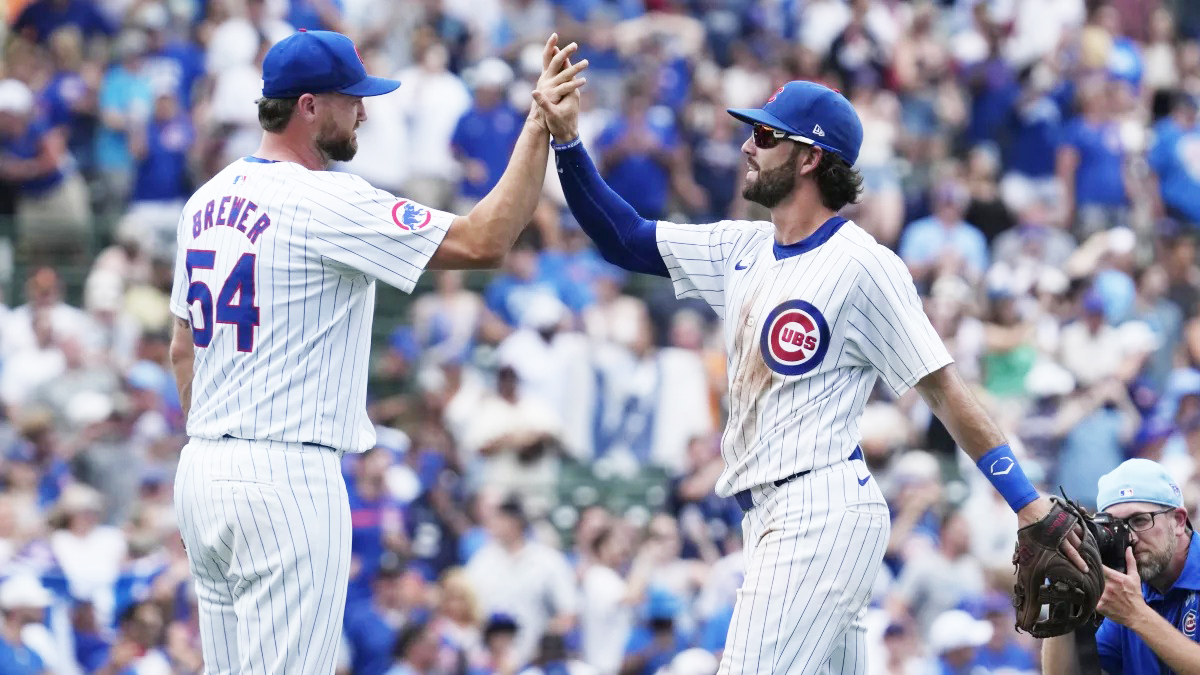photo of two chicago cubs players high fiving.