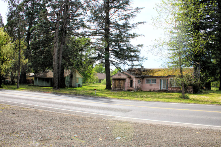 photo of two boarded up hoses.