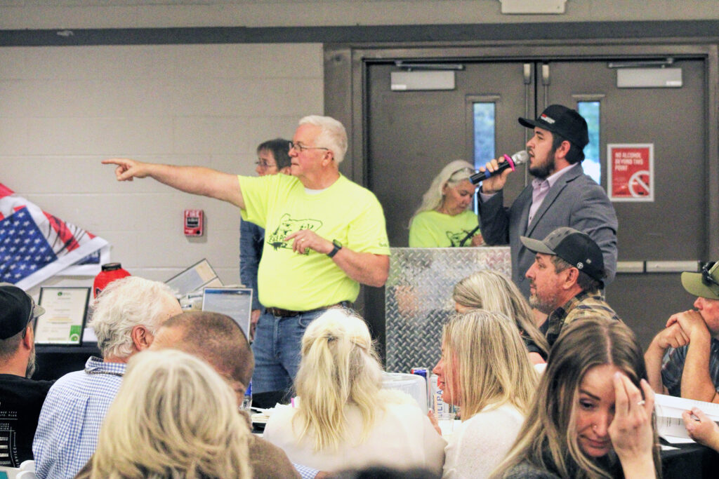 photo of a group of people at a casual auction.