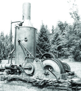 black and white photo of an old piece of logging machinery.
