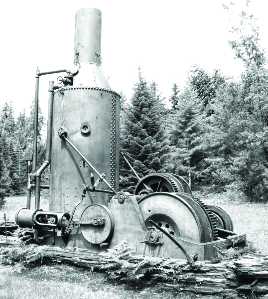 black and white photo of an old piece of logging machinery.