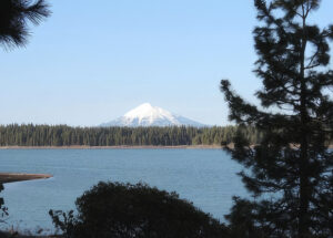 photo of a mountain reservoir with mt. McLoughlin behind it.