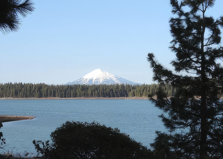 photo of a mountain reservoir with mt. McLoughlin behind it.