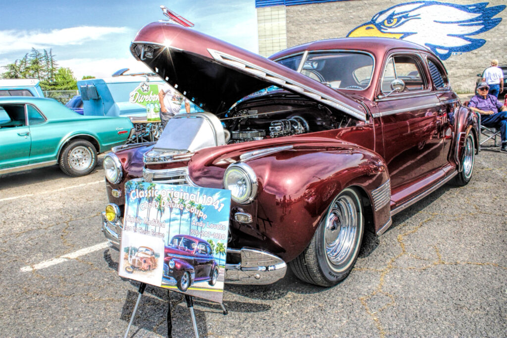 photo of a maroon classic car.