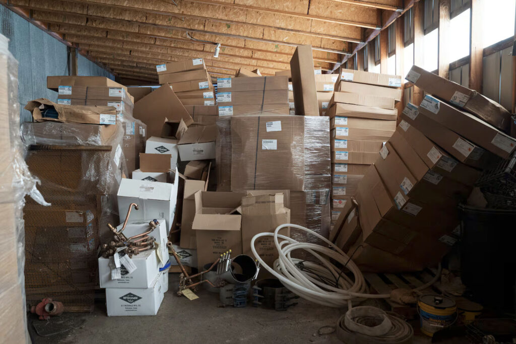 photo of a warehouse full of boxed up equipment.