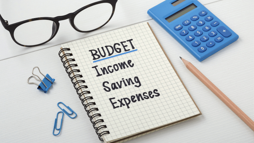 graphic for budget with calculator, glasses, pencil and note pad.