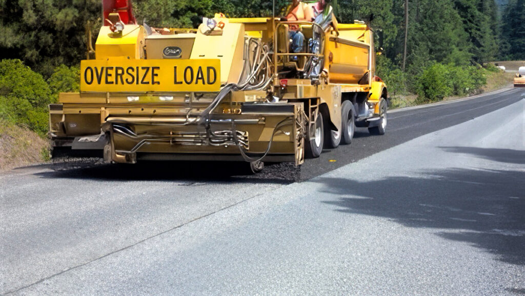 photo of chip sealing in progress.