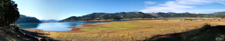 panoramic photo of lost creek lake with a very low water level.