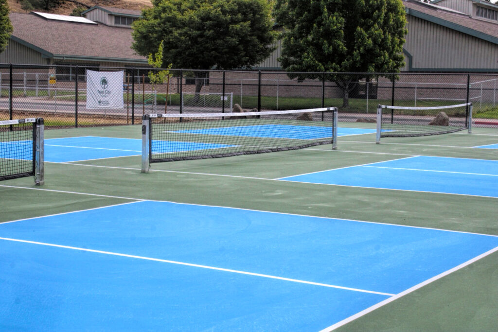 photo of newly surfaced pickle ball courts.