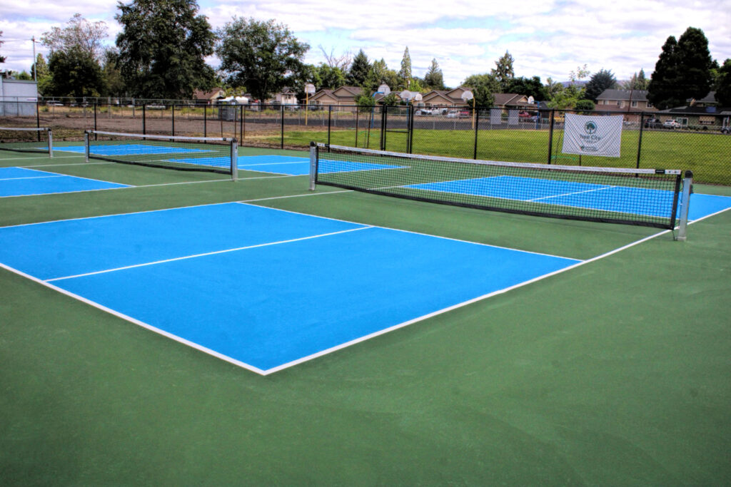 photo of newly surfaced pickle ball courts.