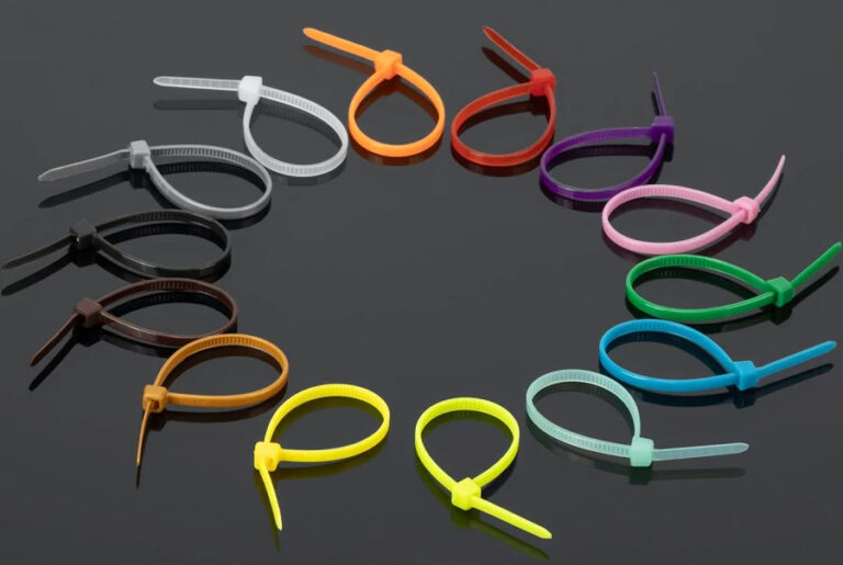 photo of a collection of zip ties in every color of the rainbow as well as brown, black, gray and white.