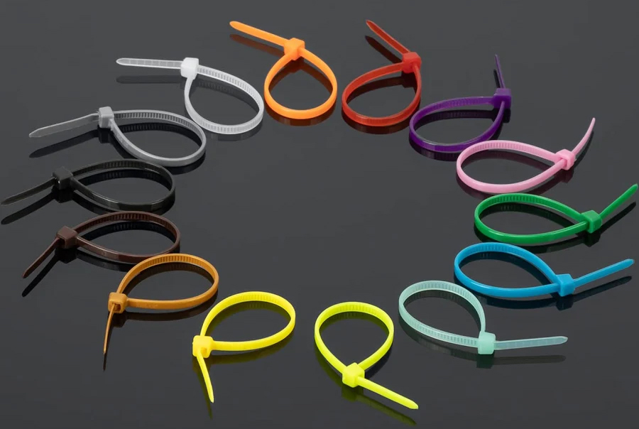 photo of a collection of zip ties in every color of the rainbow as well as brown, black, gray and white.
