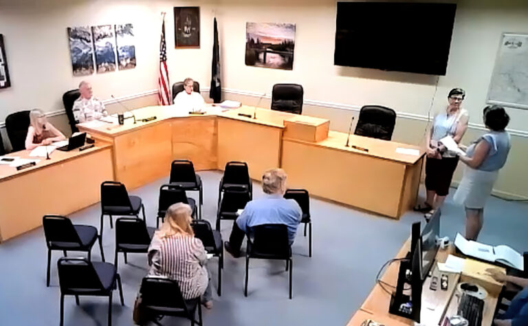 photo of a city councilor being sworn in.