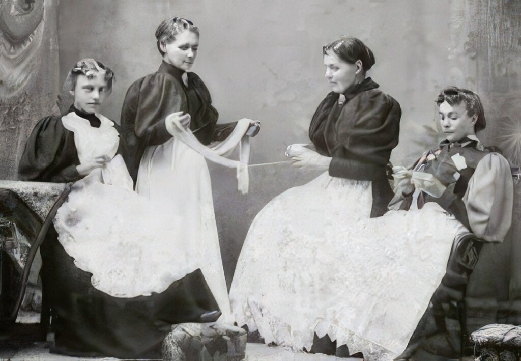 black and white photo of victorian women crafting.