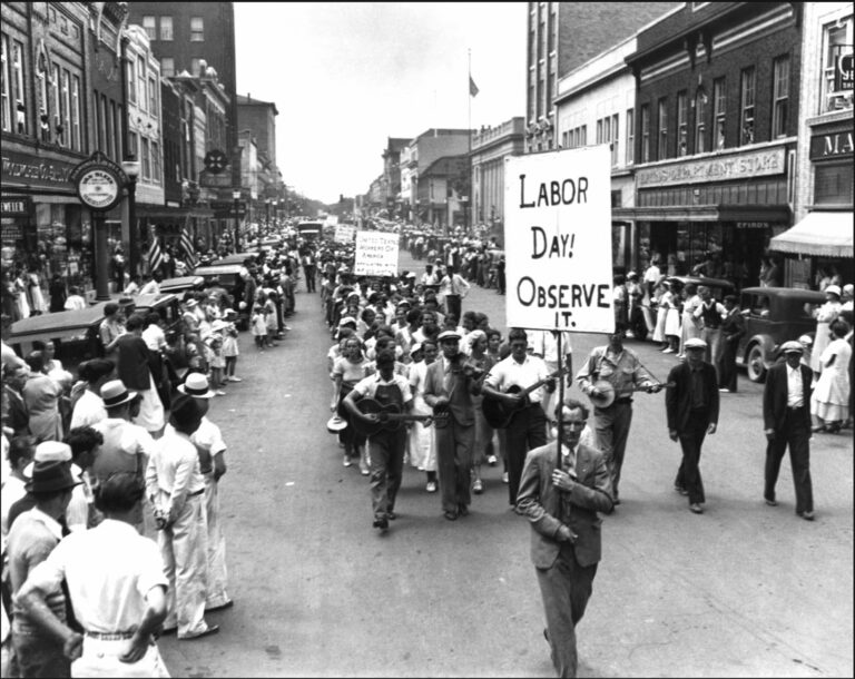 black and white photo of an early labor day parade.