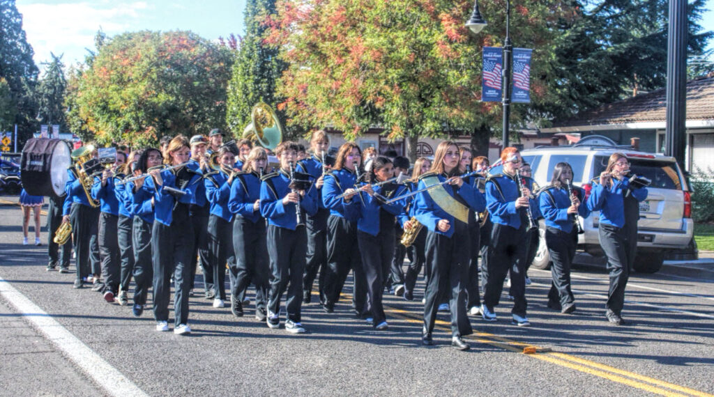 photo of a high school marching band in a parade.