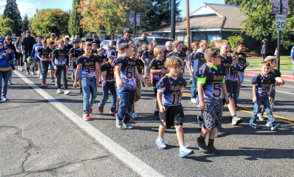 photo of youth football team in a parade.