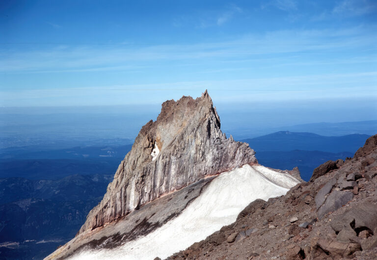 photo of a sharp, rocky peak near the top of mount hood.